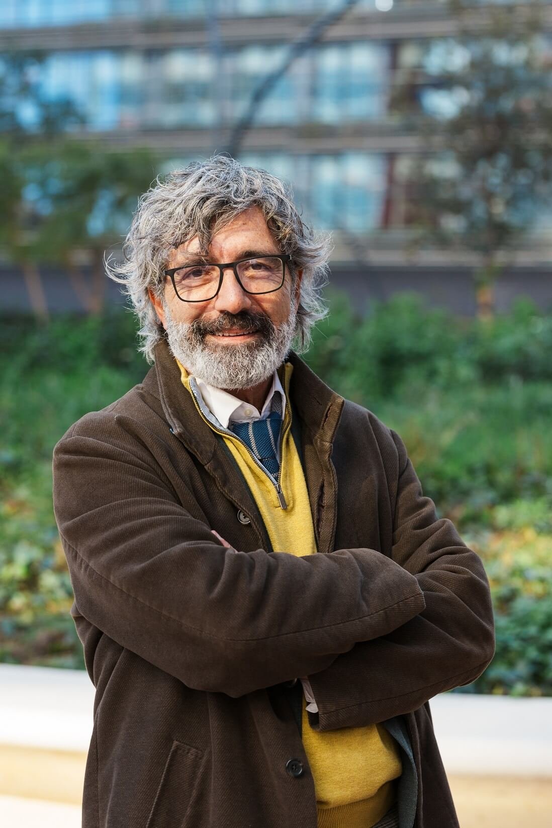 middle aged businessman smiling while posing with G833BNS