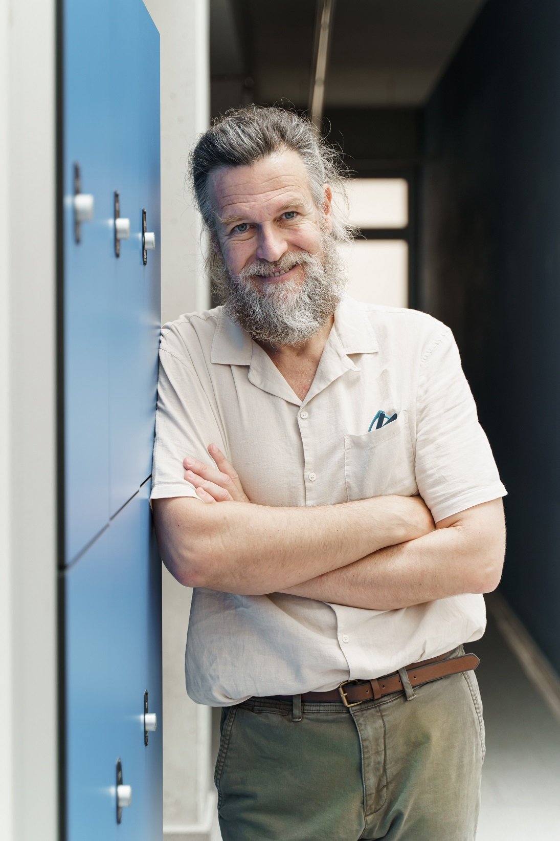 middle aged male teacher with beard standing in sc GKZ724K