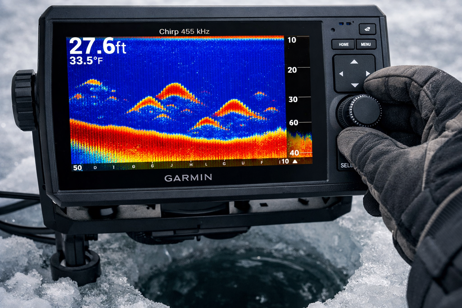 Close-up editorial photograph of a Garmin ECHOMAP 73cv sonar unit screen mounted on ice fishing rod holder, displaying vivid