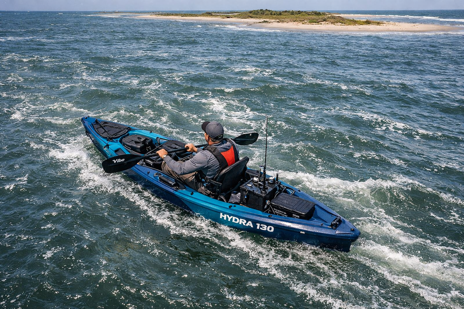() overhead aerial drone-style photograph of a Vibe Hydra 130 kayak cutting through a tidal channel with visible current,
